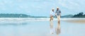 Asian Lifestyle senior couple walking chill on the beach happy in love romantic and relax time after retirement.ÃÂ  Royalty Free Stock Photo